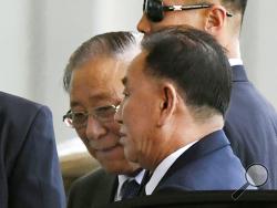 Kim Yong Chol, foreground, a former military intelligence chief who is now North Korean leader Kim Jong Un's top official on inter-Korean relations, arrives at Beijing airport in Beijing Wednesday, May 30, 2018. Kim Yong Chol was headed to New York for talks with U.S. Secretary of State Mike Pompeo. (Madoka Ikegami/Kyodo News via AP)