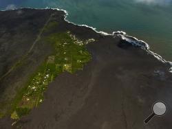 Most of the Kapoho area including the tide pools is now covered in fresh lava with few properties still intact as the Kilauea Volcano lower east rift zone eruption continues on Wednesday, June 6, 2018, in Pahoa, Hawaii. (AP Photo/LE Baskow)