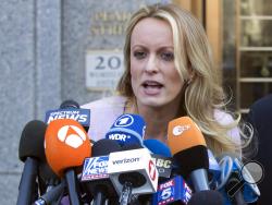 FILE - In this April 16, 2018, file photo, adult film actress Stormy Daniels speaks outside federal court, in New York. According to a person familiar with the matter, on Monday, June 25, 2018, Daniels will meet with federal prosecutors in New York who are investigating President Donald Trump's former personal attorney, in preparation for a possible grand jury appearance. (AP Photo/Mary Altaffer, File)