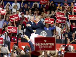 President Donald Trump, right, embraces South Carolina Gov. Henry McMaster during a speech at Airport High School on Monday, June 25, 2018, in West Columbia, S.C. (Tracy Glantz/The State via AP)