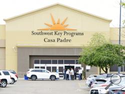 FILE - In this June 18, 2018 file photo, dignitaries take a tour of Southwest Key Programs Casa Padre, a U.S. immigration facility in Brownsville, Texas, where children who have been separated from their families are detained. The American Civil Liberties Union says it appears the Trump administration will miss a Tuesday, July 10 deadline to reunite young children with their parents in more than half of the cases. The group said the administration provided it with a list of 102 children under 5 years old wh