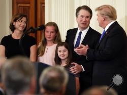 President Donald Trump greets Judge Brett Kavanaugh his Supreme Court nominee, in the East Room of the White House, Monday, July 9, 2018, in Washington. (AP Photo/Evan Vucci)