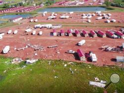 This aerial image from video, shot with a drone provided by HRI Aerial Imaging, shows damage at an RV park Tuesday, July 10, 2018, in Watford City, N.D., after a violent storm whipped through the northwestern North Dakota city overnight. More than two dozen people were hurt in the storm that overturned recreational vehicles and tossed mobile homes, officials said Tuesday. (HRI Aerial Imaging via AP)