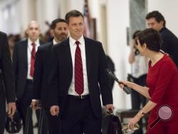 FILE - In this June 27, 2018, file photo, Peter Strzok, the FBI agent facing criticism following a series of anti-Trump text messages, walks to gives a deposition before the House Judiciary Committee on Capitol Hill in Washington. Strzok, whose anti-Trump text messages fueled suspicions of partisan bias will tell lawmakers July 12 that his law enforcement work has never been tainted by political considerations and that the intense congressional scrutiny of him represents “just another victory notch in Putin