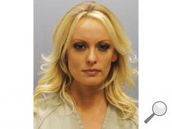 This photo provided by the Franklin County Sheriff's Office on Thursday, July 12, 2018, shows porn actress Stormy Daniels. Daniels was arrested at a Columbus, Ohio strip club and is accused of letting patrons touch her in violation of a state law, her attorney said early Thursday. (Franklin County Sheriff's Office via AP)