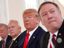 U.S. President Donald Trump, second right, is flanked by, from left, Security Adviser John Bolton, the US ambassador to Finland Robert Frank Pence and U.S. Secretary of State Mike Pompeo during a working breakfast with Finnish President Sauli Niinisto in Helsinki, Finland, Monday, July 16, 2018 prior to his meeting with Russian President Vladimir Putin in the Finnish capital. (AP Photo/Pablo Martinez Monsivais)