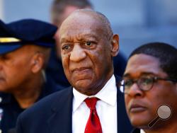 FILE - In this April 26, 2018 file photo, Bill Cosby, center, leaves the the Montgomery County Courthouse in Norristown, Pa. A representative from the Sexual Offenders Assessment Board has issued an assessment recommending that Bill Cosby be classified as a sexually violent predator. Cosby, 81, was convicted April 26 on sexual assault charges related to accusations he had drugged and assaulted Andrea Constand in his home in 2004. He is scheduled for sentencing on Sept. 24. (AP Photo/Matt Slocum, File)