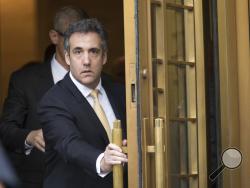 Michael Cohen leaves Federal court, Tuesday, Aug. 21, 2018, in New York. Cohen, has pleaded guilty to charges including campaign finance fraud stemming from hush money payments to porn actress Stormy Daniels and ex-Playboy model Karen McDougal. (AP Photo/Mary Altaffer)