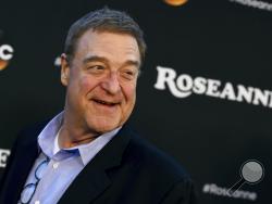 FILE - In this March 23, 2018 file photo, John Goodman arrives at the Los Angeles premiere of "Roseanne" in Burbank, Calif. Goodman is speculating that this fall's "Roseanne" spinoff will mean curtains for the matriarch played by Roseanne Barr. In an interview with the Sunday Times of London, Goodman said he wasn't sure how the new series, titled "The Conners," will be structured. (Photo by Jordan Strauss/Invision/AP, File)