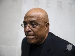 FILE - In this Aug. 1, 2017, file photo, former Reading Mayor Vaughn Spencer departs from the federal courthouse in Philadelphia. Spencer, who prosecutors said sold off the powers of his office for campaign contributions, was found guilty Thursday, Aug. 30, 2018, in a federal corruption trial. (AP Photo/Matt Rourke, File)