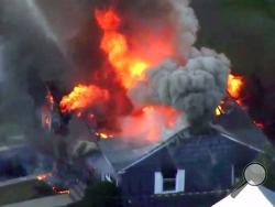 In this image take from video provided by WCVB in Boston, flames consume a home in Lawrence, Mass, a suburb of Boston, Thursday, Sept. 13, 2018. Emergency crews are responding to what they believe is a series of gas explosions that have damaged homes across three communities north of Boston. (WCVB via AP)