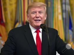 FILE - In this Sept. 12, 2018, file photo, President Donald Trump speaks during a Congressional Medal of Honor Society Reception in the East Room of the White House in Washington. (AP Photo/Susan Walsh, File)