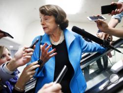 Sen. Dianne Feinstein, D-Calif., is surrounded by reporters as she arrives for a vote, Tuesday, Sept. 18, 2018, on Capitol Hill in Washington. (AP Photo/Jacquelyn Martin)