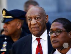 FILE - In this April 26, 2018 file photo, Bill Cosby, center, leaves the the Montgomery County Courthouse in Norristown, Pa., after being convicted of drugging and molesting a woman. Cosby is facing the start of a sentencing hearing on Monday, Sept. 24, 2018, at which a judge will decide how to punish the 81-year-old comedian who was convicted in April of drugging and sexually assaulting former Temple University athletics employee Andrea Constand at his suburban Philadelphia home in 2004. (AP Photo/Matt Slo