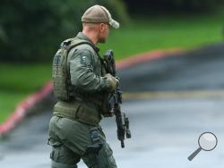Authorities respond to a shooting in Harford County, Md., Thursday, Sept. 20, 2018. Authorities say multiple people have been shot in northeast Maryland in what the FBI is describing as an "active shooter situation." (Jerry Jackson /The Baltimore Sun via AP)