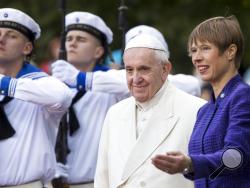 President of Estonia Kersti Kaljulaid, right, welcomes Pope Francis as he arrives at the Kadriorg Presidential Palace in Tallinn, Estonia, Tuesday, Sept. 25, 2018. Pope Francis concludes his four-day tour of the Baltics visiting Estonia. (AP Photo/Mindaugas Kulbis)