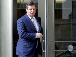 FILE - In this Feb. 14, 2018 file photo, Paul Manafort, President Donald Trump's former campaign chairman, leaves the federal courthouse in Washington. Manafort says in a statement that a Guardian report saying he met with Assange at the Ecuadorian embassy is "totally false and deliberately libelous." Manafort says that he has never been contacted by "anyone connected to WikiLeaks, either directly or indirectly." (AP Photo/Pablo Martinez Monsivais, File)