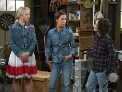This image released by ABC shows Lecy Goranson, from left, Laurie Metcalf and Sara Gilbert in a scene from "The Connors," airing Tuesdays on ABC. (Eric McCandless/ABC via AP)