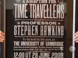 A poster advertising Time Travellers meeting hosted by Stephen Hawking, is one of the personal and academic possessions of Stephen Hawking at the auction house Christies in London, Friday, Oct. 19, 2018. The online auction announced Monday Oct. 22, 2018, by auctioneer Christie’s features 22 items from Hawking, including his doctoral thesis on the origins of the universe, with the sale scheduled for 31 October and 8 November. (AP Photo/Frank Augstein)