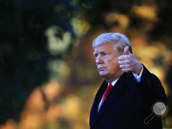 President Donald Trump gestures as he leaves the White House in Washington, Wednesday, Oct. 24, 2018, to attend a campaign rally in Mosinee, Wis. (AP Photo/Manuel Balce Ceneta)