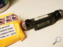 This image obtained Wednesday, Oct. 24, 2018, and provided by ABC News shows a package addressed to former CIA head John Brennan and an explosive device that was sent to CNN's New York office. The mail-bomb scare widened Thursday as law enforcement officials seized more suspicious packages. (ABC News via AP)