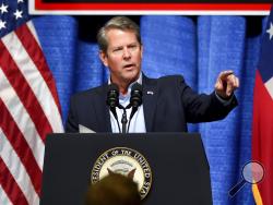 In this Thursday, Nov. 1, 2018, photo, Georgia Republican gubernatorial candidate Brian Kemp speaks during a rally at the Columbia County Exhibition Center in Grovetown, Ga. The official office of Georgia Secretary of State Brian Kemp said Sunday, Nov. 4, it is investigating the state Democratic Party in connection with what it said was an attempted hack of the state’s online voter database that will be used at polling places in Tuesday’s election. (Michael Holahan/The Augusta Chronicle via AP)