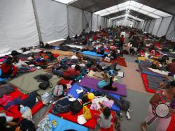Central American migrants, part of a caravan hoping to reach the U.S. gets settled in a shelter at the Jesus Martinez stadium, in Mexico City, Monday, Nov. 5, 2018. Thousands of Central American migrants have arrived at the stadium, still hundreds of miles away from their goal of reaching the U.S. a day before midterm elections in which they unwittingly became a central issue. (AP Photo/Marco Ugarte)