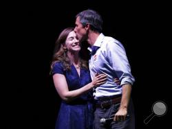 Rep. Beto O'Rourke, D-Texas, the 2018 Democratic Candidate for U.S. Senate in Texas, right, stands with his wife, Amy Sanders, at his election night party, Tuesday, Nov. 6, 2018, in El Paso, Texas. (AP Photo/Eric Gay)