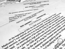 A portion of a once-classified CIA report that disclosed the existence of a drug research program dubbed "Project Medication" is photographed in Washington, Tuesday, Nov. 13, 2018. Shortly after 9/11, the CIA considered using a drug that might work like a truth serum and force terror suspects to give up information about potential attacks. After months of research, the agency decided that a drug called Versed, a sedative often prescribed to reduce anxiety, was “possibly worth a try.” But in the end, the CIA
