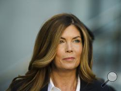 FILE - In this Monday, Oct. 24, 2016, file photo, former Pennsylvania Attorney General Kathleen Kane arrives at Montgomery County courthouse for her sentencing hearing in Norristown, Pa. The Pennsylvania state Supreme Court on Monday, Nov. 26, 2018, announced it will not review Kane's conviction for leaking grand jury information and lying about it, and the Montgomery County district attorney's office said it plans to ask a judge the following morning to revoke her bail. (AP Photo/Matt Rourke, File)