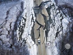 This aerial photo shows damage on Vine Road, south of Wasilla, Alaska, after earthquakes Friday, Nov. 30, 2018. Back-to-back earthquakes measuring 7.0 and 5.7 shattered highways and rocked buildings Friday in Anchorage and the surrounding area, sending people running into the streets and briefly triggering a tsunami warning for islands and coastal areas south of the city. (Marc Lester/Anchorage Daily News via AP)