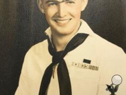 This photo provided by retired U.S. Navy Cmdr. Don Long shows Long in his Navy uniform in 1943. Long wasn't at Pearl Harbor when Japanese warplanes bombed Hawaii on December 7, 1941 - he was on the opposite side of Oahu aboard an anchored seaplane in Kaneohe Bay. But the Japanese strike reached his installation soon after Pearl Harbor, and the young sailor watched from afar as explosions and gunfire consumed him and his comrades. Now, 77 years later, Long will remember that day from even farther away - acro
