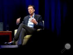 FILE - In this April 30, 2018, file photo, former FBI director James Comey speaks during a stop on his book tour in Washington. House Republicans are preparing to interview Comey behind closed doors Friday, Dec. 7, hauling the former FBI Director to Capitol Hill one final time before they cede power to Democrats in January. ( AP Photo/Jose Luis Magana, File)
