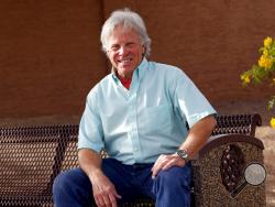 In this Nov. 20, 2018 photo, Joseph Soldwedel, the publisher of the Prescott Daily Courier, poses for a photo in Phoenix. Soldwedel, the owner of a chain of small Arizona newspapers, and his wife Felice are locked in a nasty divorce dispute that includes allegations of poisoning. (AP Photo/Matt York)