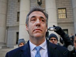 FILE - In this Nov. 29, 2018, file photo, Michael Cohen walks out of federal court in New York. The moment of reckoning has nearly arrived for Cohen, who finds out Wednesday, Dec. 12, whether his decision to walk away from President Donald Trump after years of unwavering loyalty will spare him from a harsh prison sentence. (AP Photo/Julie Jacobson, File)