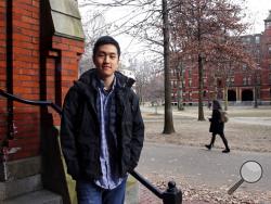 Harvard University graduate Jin K. Park, who holds a degree in molecular and cellular biology, poses at Harvard Yard in Cambridge, Mass., Thursday, Dec. 13, 2018. Park, who was named a Rhodes Scholar along with 30 other Americans in November, entered the U.S. illegally as a child, moving to Queens borough of New York City with his family. The undocumented student, who participates in the Deferred Action for Childhood Arrivals program (DACA), is not sure if he'll be allowed back in the U.S. after his studies