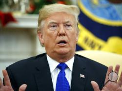 In this Dec. 11, 2018 photo, President Donald Trump speaks during a meets with Democratic leaders the Oval Office in Washington. Against the advice of many in his own administration, Trump is pulling U.S. troops out of Syria. But the abruptness with which Trump is turning the page on Syria is raising questions about whether he might not do the same in Iraq or Afghanistan. (AP Photo/Evan Vucci)