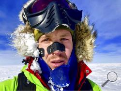 This Dec. 9, 2018, selfie provided by Colin O'Brady, of Portland., Ore., shows himself in Antarctica. He has become the first person to traverse Antarctica alone without any assistance. O'Brady finished the 932-mile (1,500-kilometer) journey across the continent in 54 days, lugging his supplies on a sled as he skied in bone-chilling temperatures. (Colin O'Brady via AP)