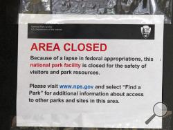 A closed sign is displayed on a door at the Lincoln Memorial in Washington, Tuesday, Jan. 1, 2019, as a partial government shutdown stretches into its third week. A high-stakes move to reopen the government will be the first big battle between Nancy Pelosi and President Donald Trump as Democrats come into control of the House. (AP Photo/Jose Luis Magana)