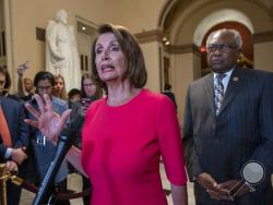 Speaker of the House Nancy Pelosi, D-Calif., center, joined at right by Majority Whip James Clyburn, D-S.C., pushes back on President Donald Trump's demand to fund a wall on the US-Mexico border with the partial government shutdown in its second week, at the Capitol in Washington, Thursday, Jan. 3, 2019. (AP Photo/J. Scott Applewhite)