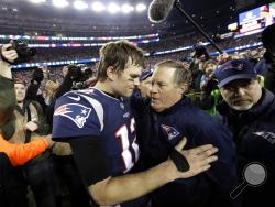 FILE - In this Jan. 21, 2018, file photo, New England Patriots quarterback Tom Brady, left, hugs coach Bill Belichick after the AFC championship NFL football game against the Jacksonville Jaguars in Foxborough, Mass. New England’s five Super Bowl champions turned over an average of 19.2 players the season after they won their titles. Brady and Belichick have been the constant. (AP Photo/David J. Phillip, File)