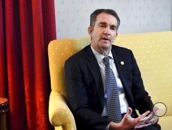 Virginia Gov. Ralph Northam talks during an interview at the Governor's Mansion, Saturday, Feb. 9, 2019 in Richmond, Va. The embattled governor says he wants to spend the remaining three years of his term pursuing racial "equity." Northam told The Washington Post that there is a higher reason for the "horrific" reckoning over a racist photograph that appeared in his medical school yearbook. (Katherine Frey/The Washington Post via AP)