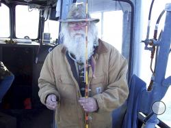 This 2008 photo provided by Chardonnay Telly shows Richard Brown fishing in Fort Bragg, Calif. Flames overtook 74-year-old Richard Brown’s beloved log cabin in the Sierra Nevada foothills. (Chardonnay Telly via AP)