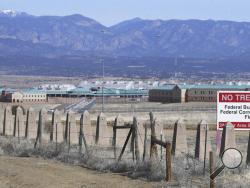 The Rocky Mountains can be seen in the distance behind the Federal Correctional Complex near Florence, Colo. Within the complex is Supermax, where Mexican drug kingpin Joaquin "El Chapo" Guzman will be serving his prison sentence. Known as the "Alcatraz of the Rockies," the Administrative Maximum Security facility, also referred to as Supermax, houses some of the most notorious criminals to set foot in an American courtroom. (Jerilee Bennett/The Gazette via AP)