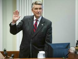 Mark Harris, Republican candidate in North Carolina's 9th Congressional race, prepares to testify during the fourth day of a public evidentiary hearing on the 9th Congressional District voting irregularities investigation Thursday, Feb. 21, 2019, at the North Carolina State Bar in Raleigh, N.C. (Travis Long/The News & Observer via AP, Pool)