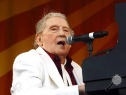 FILE - In this May 2, 2015 file photo, Jerry Lee Lewis performs at the New Orleans Jazz & Heritage Festival in New Orleans. Rock ’n’ roll pioneer Lewis is recovering after a minor stroke, but he’s expected to make a full recovery. A statement from his publicist says the 83-year-old Rock & Roll Hall of Famer had the stroke Thursday night, Feb. 28, 2019, and is recuperating in Memphis. (Photo by John Davisson/Invision/AP, File)