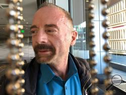 Timothy Ray Brown poses for a photograph, Monday, March 4, 2019, in Seattle. Brown, also known as the "Berlin patient," was the first person to be cured of HIV infection, more than a decade ago. Now researchers are reporting a second patient has lived 18 months after stopping HIV treatment without sign of the virus following a stem-cell transplant. But such transplants are dangerous, cannot be used widely and have failed in other patients. (AP Photo/Manuel Valdes)