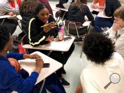 Sophomore Ramaya Wright, 15, second from left, leads a group making a list of the characteristics of an abusive relationship, during a class at Central Catholic High School in Portland, Ore., on April 15, 2019.(AP Photo/Gillian Flaccus)
