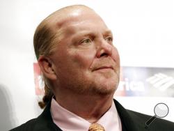 FILE - In this Wednesday, April 19, 2017, file photo, chef Mario Batali attends an awards event in New York. The Suffolk County District Attorney s Office in Boston says Batali is scheduled to be arraigned Friday, May 24, 2019, on a charge of indecent assault and battery, in connection with an allegation that he forcibly kissed and groped a woman at a Boston restaurant in 2017. (Photo by Brent N. Clarke/Invision/AP, File)