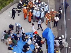 This aerial photo shows the scene of an attack in Kawasaki, near Tokyo Tuesday, May 28, 2019. A man wielding a knife attacked commuters waiting at a bus stop just outside Tokyo during Tuesday morning's rush hour, Japanese authorities and media said. (Jun Hirata/Kyodo News via AP)